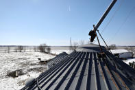 A grain storage bin belonging to farmer Austin Rincker stands in Moweaqua, Illinois, U.S., March 6, 2019. REUTERS/Daniel Acker/Files