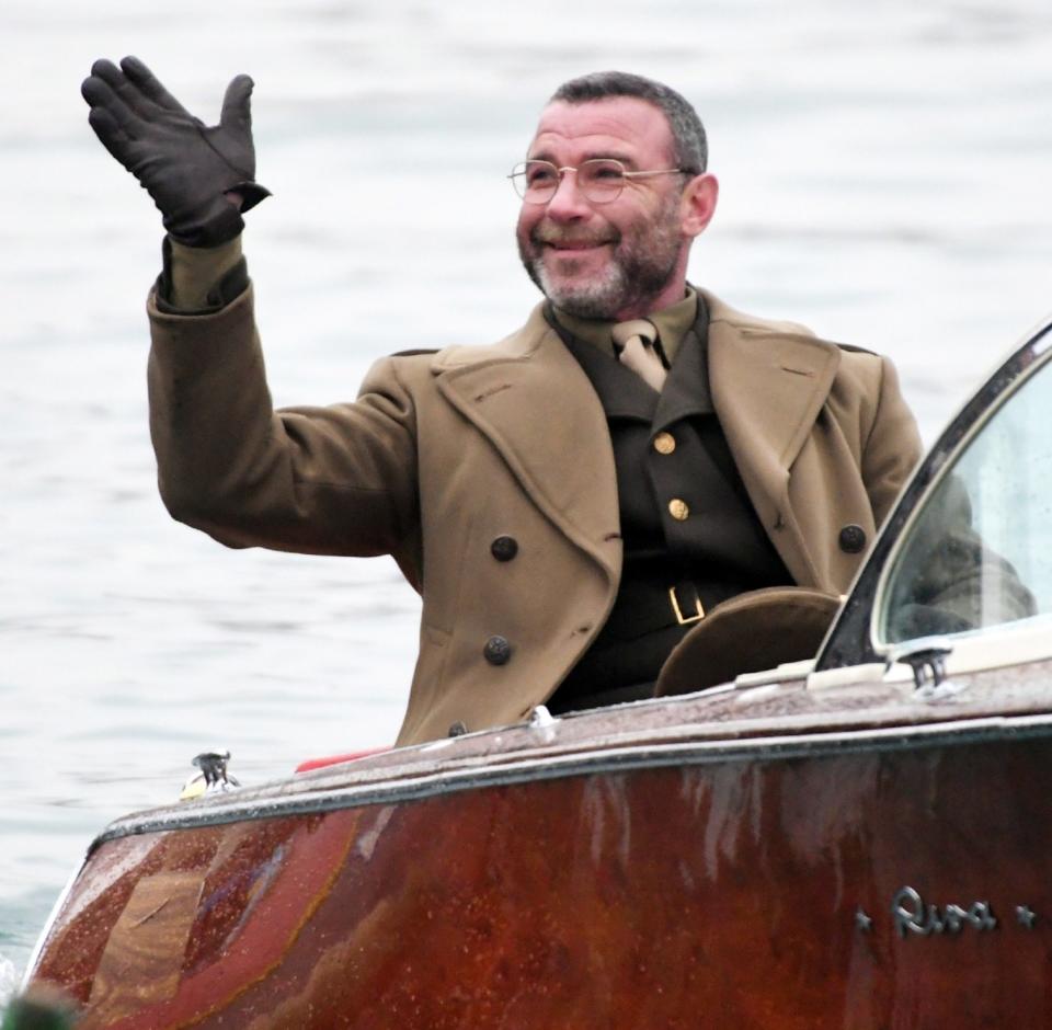 <p>Liev Schreiber waves while filming scenes for <em>Across the River and into the Trees</em> in Venice, Italy, on Wednesday.</p>