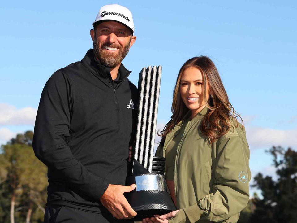 <p>Michael Reaves/Getty</p> Dustin Johnson and Paulina Gretzky after winning during day three of the LIV Golf Invitational - Las Vegas on February 10, 2024.