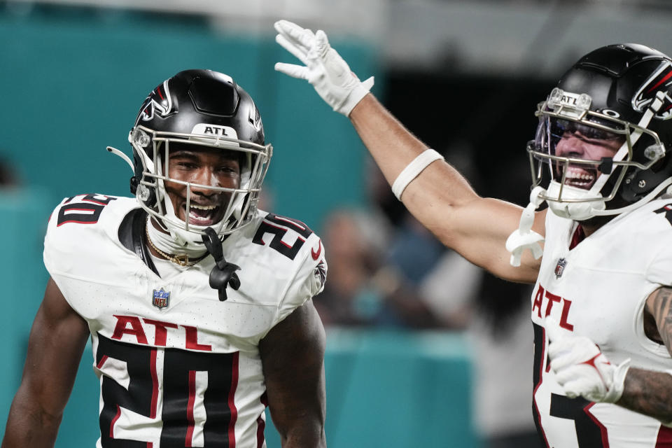 Atlanta Falcons' Dee Alford (20) cellebrates with J.J. Arcega-Whiteside (83) after returning a punt for a touchdown in the second half of a preseason NFL football game, Friday, Aug. 11, 2023, in Miami Gardens, Fla. (AP Photo/Marta Lavandier)