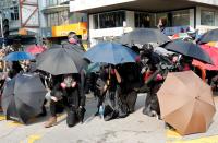 Anti-government demonstrators attend a protest march in Hong Kong