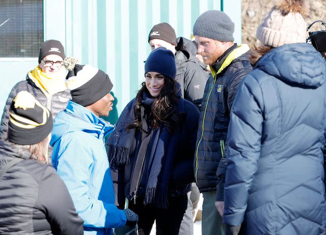 <p>Andrew Chin/Getty</p> Meghan Markle and Prince Harry attend the Invictus Games Winter Training Camp on Feb. 15, 2024