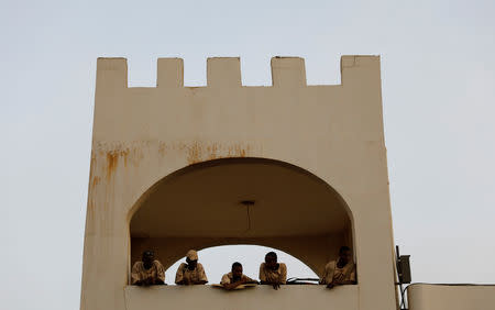 Sudanese soldiers watch demonstrators from a security tower during a protest outside the Defence Ministry in Khartoum, Sudan April 14, 2019. REUTERS/Umit Bektas