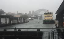 Sydney Harbour was inundated with rain as power was cut to thousands of homes around the city. Photo: Twitter/Liam Denny