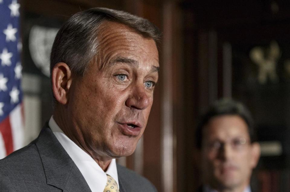 FILE - This Jan. 28, 2014 file photo shows House Speaker John Boehner of Ohio, left, accompanied by House Majority Leader Eric Cantor of Va. speaking at Republican National Committee headquarters in Washington. President Barack Obama is working to put two major emerging trade deals with Europe and Asia on a “fast track” to passage. But many congressional Democrats are working to sidetrack the proposed pacts ahead of this year’s U.S. midterm elections. The Democratic president finds himself in the rare position of having House Speaker John Boehner as an ally on the issue and Senate Majority Leader Harry Reid as a foe. (AP Photo/J. Scott Applewhite, File)