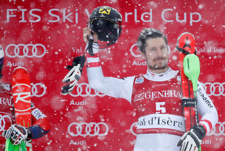 Skiing - Men's Alpine Ski World Cup Slalom - Val d´Isere, France - December 10, 2017 Austria's Marcel Hirscher celebrates on the podium after winning the Men's Alpine Ski World Cup Slalom REUTERS/Christian Hartmann