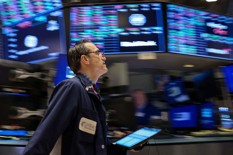 Traders work on the floor of the NYSE in New York