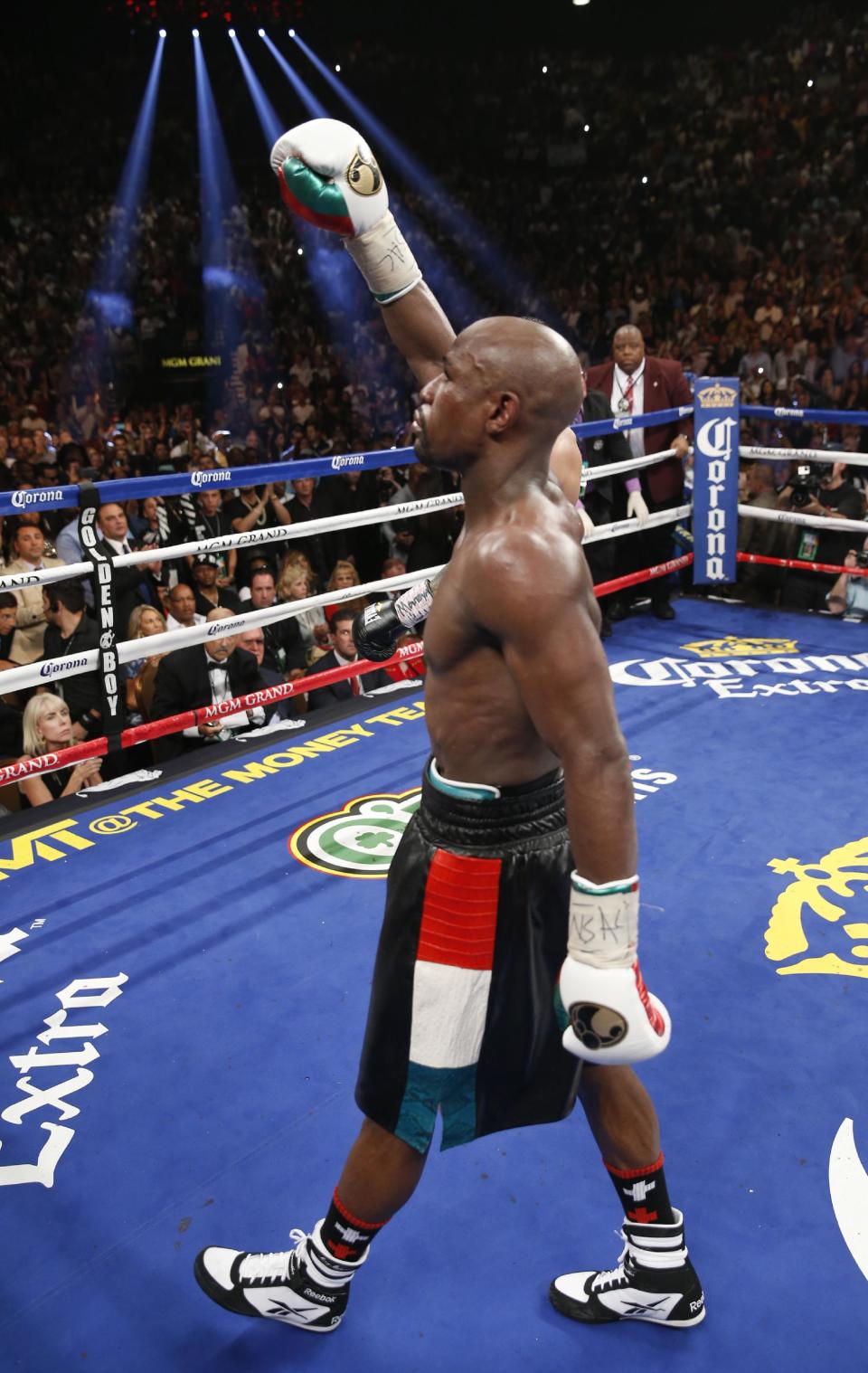 Floyd Mayweather Jr. celebrates his majority decision win over Marcos Maidana in their WBC-WBA welterweight title boxing fight Saturday, May 3, 2014, in Las Vegas. (AP Photo/Eric Jamison)