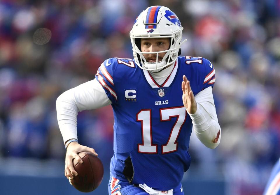 Bills quarterback Josh Allen (17) runs against the Miami Dolphins.