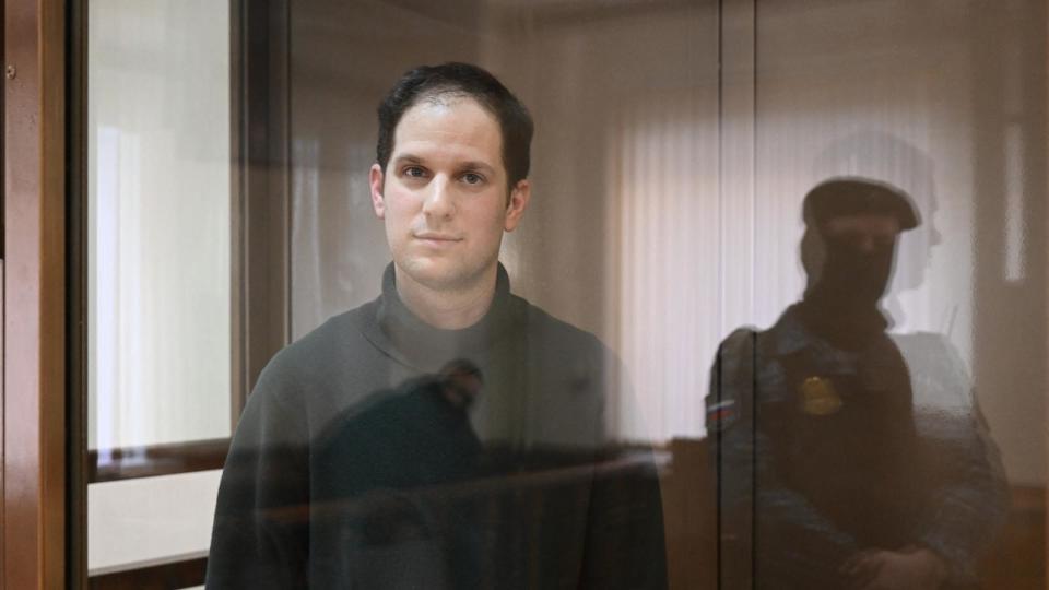 PHOTO: US journalist Evan Gershkovich, arrested on espionage charges, stands inside a defendants' cage before a hearing to consider an appeal on his extended pre-trial detention, at the Moscow City Court in Moscow on Feb. 20, 2024. (Natalia Kolesnikova/AFP via Getty Images)