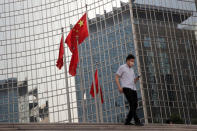 The Chinese national flag flies outside a hotel in central Beijing, China May 15, 2019. REUTERS/Thomas Peter