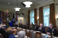 President Joe Biden speaks as he meets with his military leadership in the Cabinet Room the White House, Wednesday, April 20, 2022, in Washington. Back from left are, Navy Adm. John Aquilino, commander of US Indo-Pacific Command; Gen. Daniel Hokanson, Chief of the National Guard Bureau; Gen. Stephen Townsend, commander of the US Africa Command; Gen. David Berger, Commandant of the Marine Corps; Defense Secretary Lloyd Austin; and Chairman of the Joint Chiefs of Staff Gen. Mark Milley. (AP Photo/Evan Vucci)
