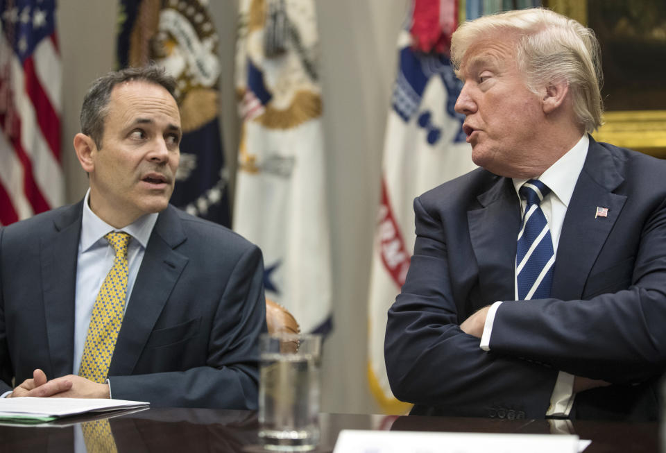 FILE - In this Thursday, Jan. 11, 2018, file photo, President Donald Trump, right, and Kentucky Gov. Matt Bevin, left, talk during a prison reform roundtable in the Roosevelt Room of the Washington. Bevin predicted Tuesday, June 25, 2019 that his political kinship with Trump will be in the campaign spotlight this year, and that Trump may visit Kentucky multiple times to help Bevin counter a tough Democratic challenge. (AP Photo/Carolyn Kaster, File)