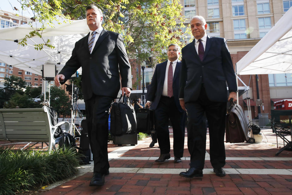 Members of the defense team for Paul Manafort, from left, Kevin Downing, Richard Westling, and Thomas Zehnle, walk to federal court for closing arguments in the trial of the former Trump campaign chairman, in Alexandria, Va., Wednesday, Aug. 15, 2018. (AP Photo/Jacquelyn Martin)