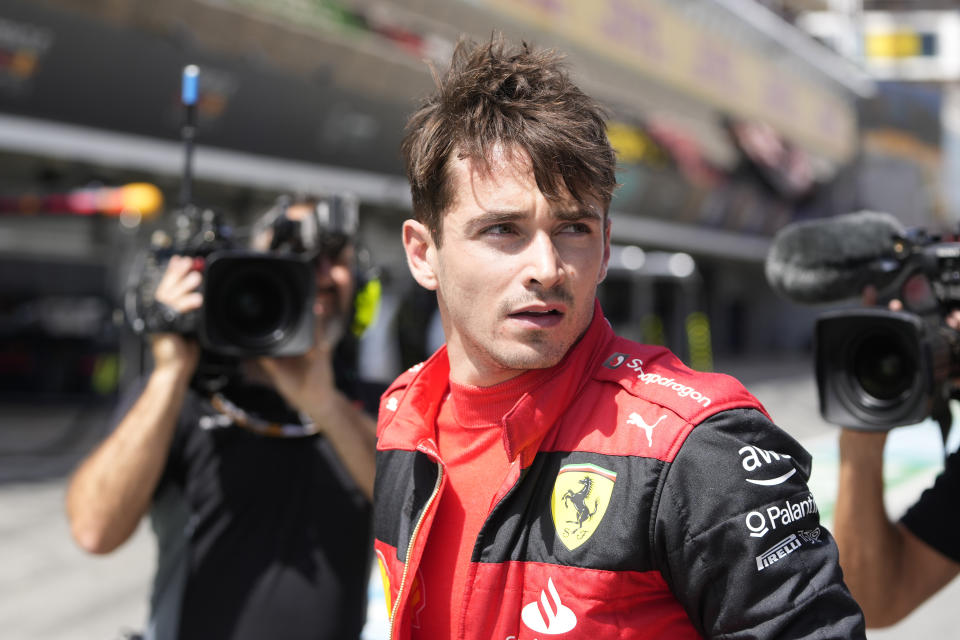 Ferrari driver Charles Leclerc of Monaco walks at the pit lane after his car's breakdown during the Spanish Formula One Grand Prix at the Barcelona Catalunya racetrack in Montmelo, Spain, Sunday, May 22, 2022. (AP Photo/Pool/Manu Fernandez)