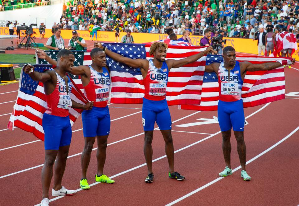 Team USA sliver medal men's 4x400 relay including Elijah Hall, left, Christian Coleman, Noah Lyles and Marvin Bracy pose after their second place finish at the World Athletics Championships at Hayward Field in Eugene, Oregon Saturday, July 23, 2022.