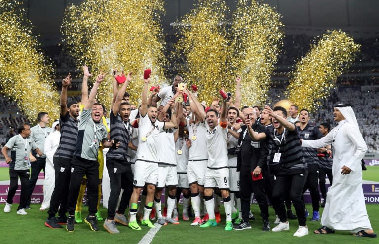 Al-Sadd's players celebrate their victory in the Qatar Emir Cup Final football match against Al-Rayyan at the Khalifa International Stadium in Doha on May 19, 2017