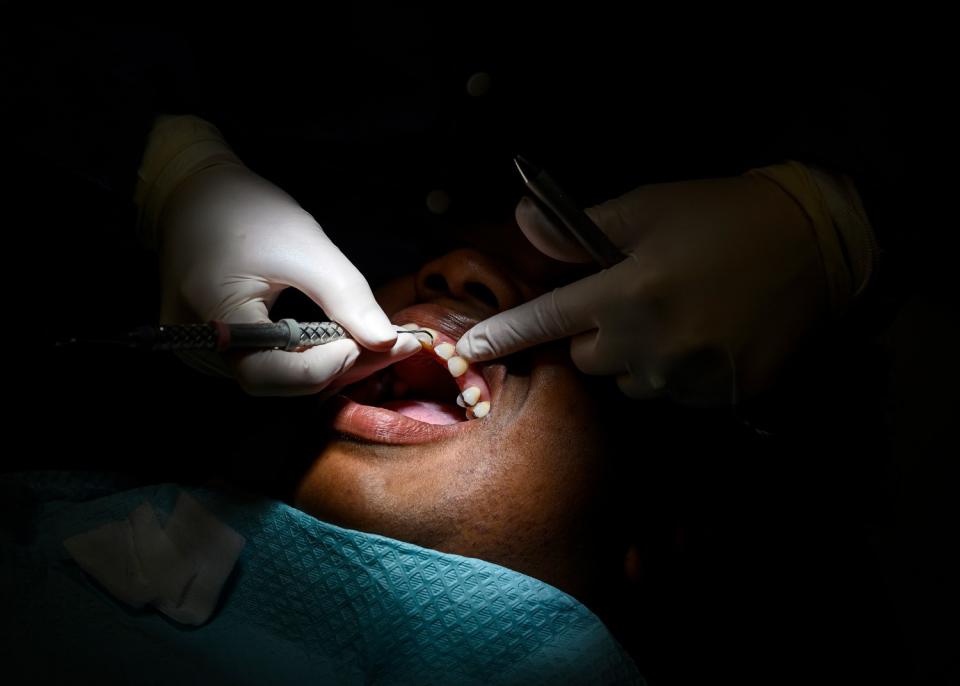 Anita Earvin gets her teeth cleaned at East Arkansas Family Health Center.