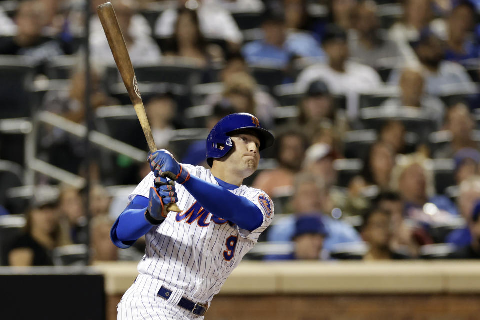 New York Mets' Brandon Nimmo watches his RBI-double during the second inning of the team's baseball game against the Colorado Rockies, Saturday, Aug. 27, 2022, in New York. (AP Photo/Adam Hunger)