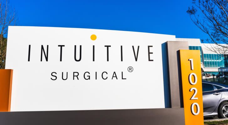 A sign with the Intuitive Surgical logo standing outside of a company office. ISRG stock.