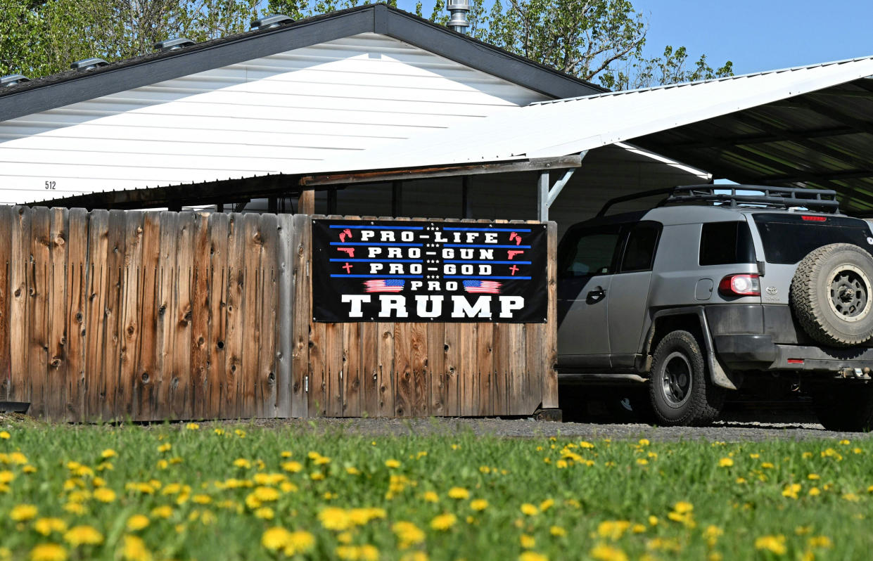 A sign in support of former President Donald Trump is displayed in front of a home in Wallowa, Ore., on May 12, 2023.  (Robyn Beck / AFP - Getty Images)