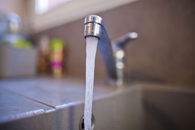<p>Getty</p> Tap water flowing from a faucet.