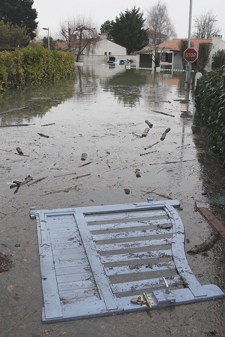 A gate floats down a flooded street of La Faute sur Mer, Monday, March 1, 2010.