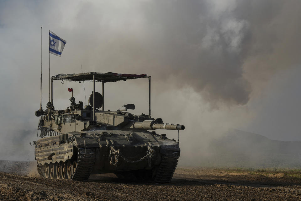 An Israeli army tank moves near the Gaza Strip border, in southern Israel, Wednesday, Jan. 24, 2024. The army is battling Palestinian militants across Gaza in the war ignited by Hamas' Oct. 7 attack into Israel. (AP Photo/Tsafrir Abayov)