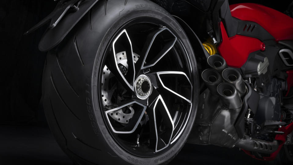At the rear, a Pirelli Diablo Rosso III tire wraps around a gorgeous five-spoke alloy wheel with machined-chrome surfaces.