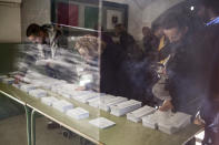 <p>Qualified voters cast a ballot for the Catalan regional election at an elementary school in Barcelona, Spain, Dec. 21, 2017. (Photograph by Jose Colon / MeMo for Yahoo News) </p>