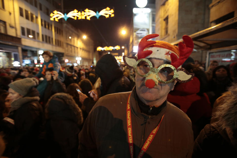 Bosnian people cheer during new year's celebrations in Sarajevo