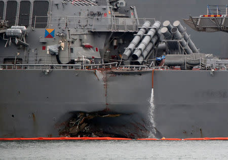 The damaged USS John McCain is docked at Changi Naval Base in Singapore August 22, 2017. REUTERS/Calvin Wong