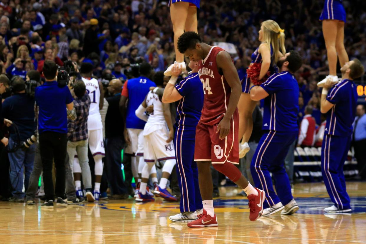 Oklahoma guard Buddy Hield walks off the floor following an NCAA college basketball game against Kansas in Lawrence, Kan., Monday, Jan. 4, 2016. Hield scored 46 points in the game. Kansas defeated Oklahoma 109-106 in triple overtime. (AP Photo/Orlin Wagner)