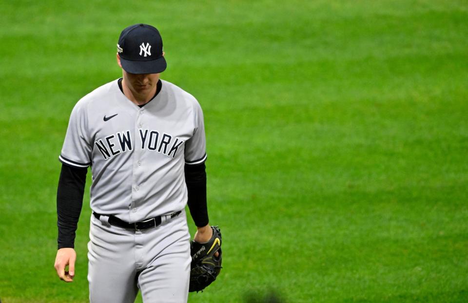 Oct 15, 2022; Cleveland, Ohio, USA; New York Yankees starting pitcher Clarke Schmidt (86) reacts after giving up the game winning hit against the Cleveland Guardians in the ninth inning during game three of the NLDS for the 2022 MLB Playoffs at Progressive Field. Mandatory Credit: David Richard-USA TODAY Sports