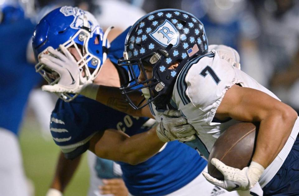 Bullard’s Dominick Gonzalez, right, shoves away Madera’s Paul D childers, left, on a run Friday, Sept. 29, 2023 in Madera. Madera led 6-0 at halftime, but Bullard rallied for the 7-6 win.