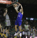 Kansas forward Mitch Lightfoot, right, dunks over Baylor guard Matthew Mayer in the first half of an NCAA college basketball game, Monday, Jan. 18, 2021, in Waco, Texas. (Rod Aydelotte/Waco Tribune-Herald via AP)