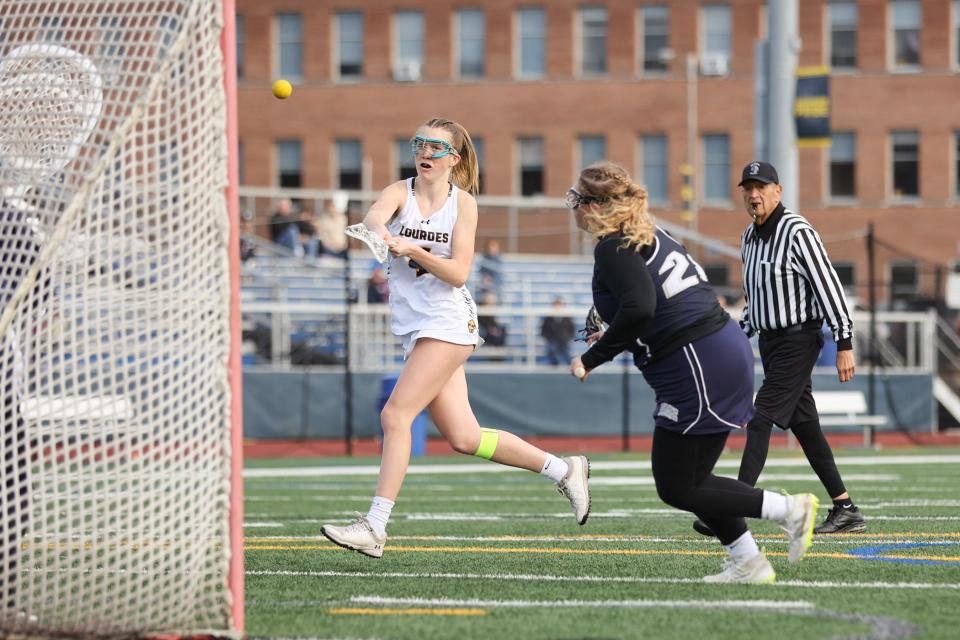 Lourdes' Deirdre Connolly takes a shot on the goal during an April 12, 2024 girls lacrosse game against Burke Catholic.