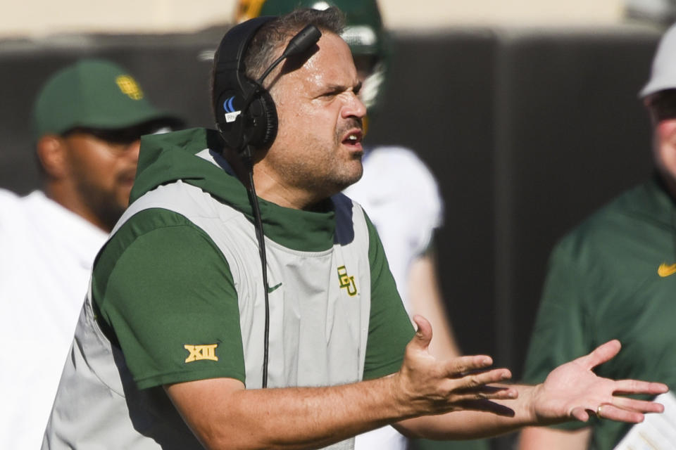 FILE - In this Oct. 19, 2019, file photo, Baylor head coach Matt Rhule gestures to an official during the first half of an NCAA college football game against Oklahoma State, in Stillwater, Okla. Baylor coach Matt Rhule and Oklahoma’s Lincoln Riley took over their teams under drastically different circumstances. Now they will coach against each other in the Big 12 championship game. (AP Photo/Brody Schmidt, File)