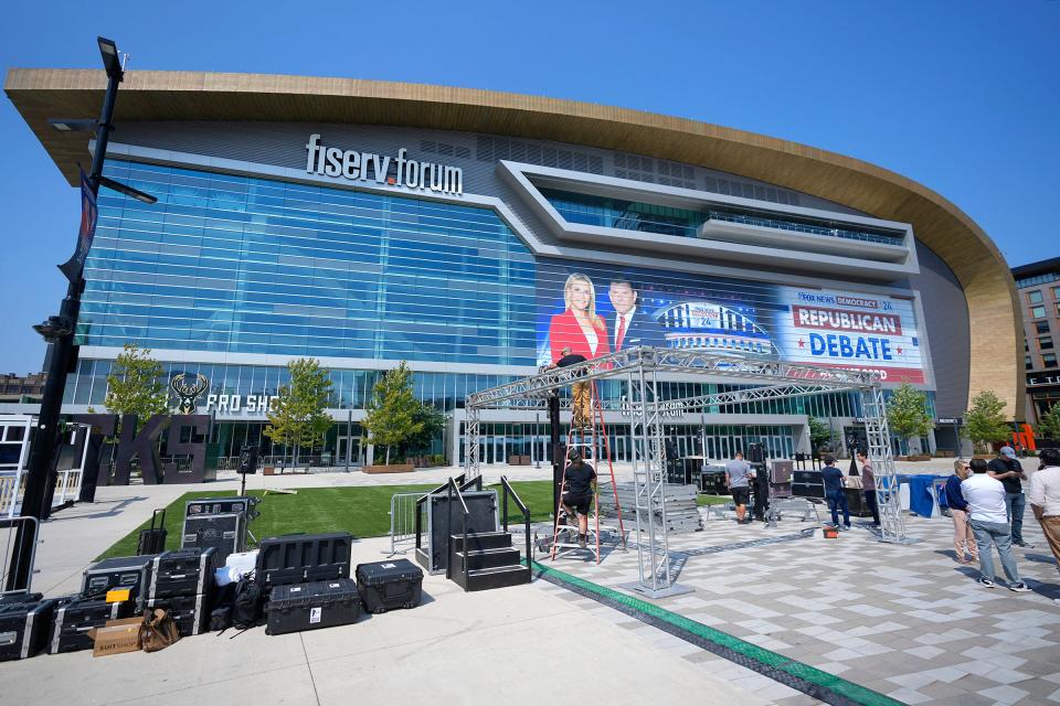 Work is done Tuesday outside Fiserv Forum in preparation for the Aug. 23 Republican presidential debate in Milwaukee on Tuesday.