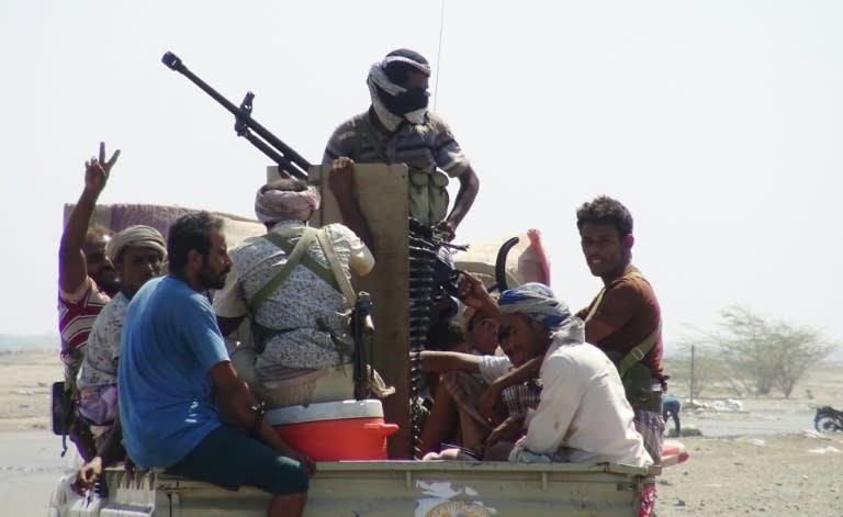 Yemeni pro-government forces gather in a street on the eastern outskirts of Hodeida as they continue to battle for the control of the city from Huthi rebels