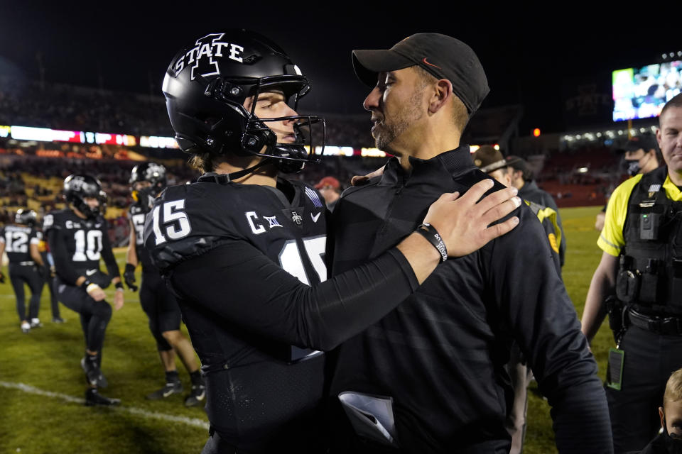 Iowa State quarterback Brock Purdy (15) gets a hug from head coach Matt Campbell, right, after an NCAA college football game against TCU, Friday, Nov. 26, 2021, in Ames, Iowa. Iowa State won 48-14. (AP Photo/Charlie Neibergall)