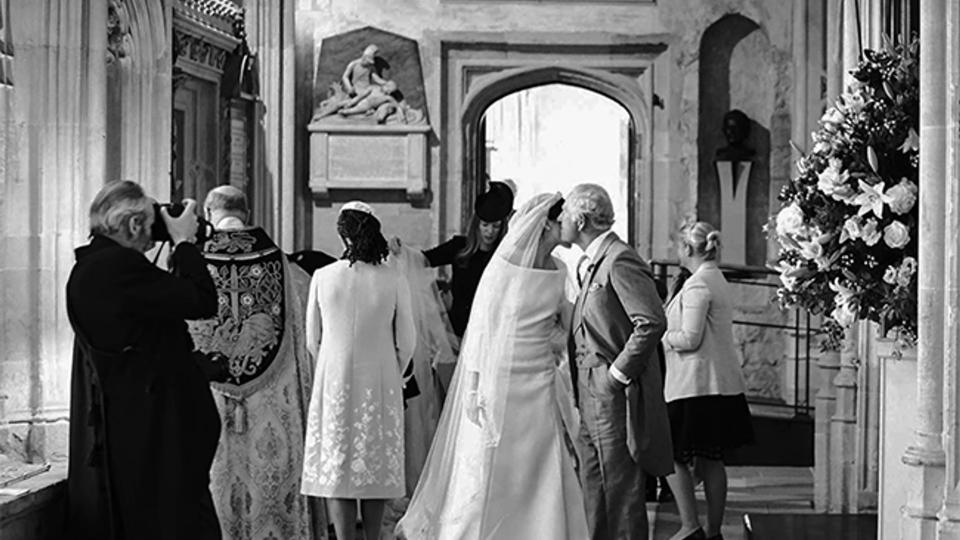 The bride was pictured kissing her father-in-law King Charles