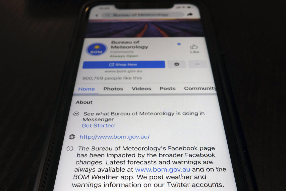 A disclaimer is shown on the bottom of Australia's Bureau of Meteorology page on the Facebook app Thursday, Feb. 18, 2021, in Tokyo. Australia's government has condemned Facebook over its shock move to prevent Australians sharing news that had also blocked some government communications. The Bureau of Meteorology's weather warnings, a Hobart women's shelter and the Betoota Advocate, a satirical website named after an Australian ghost town, were among those surprised to find their content blocked at least temporarily. (AP Photo/Kiichiro Sato)
