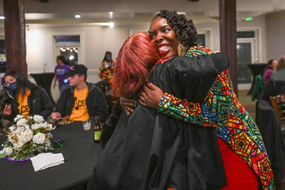 Sacramento mayoral candidate Flojaune Cofer hugs a supporter at during her election night party at Our Place in Old Sacramento on Tuesday, March 5, 2024.