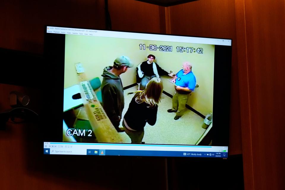 In a frame grab from video, James Crumbley, left, and his wife Jennifer Crumbley meet with their son Ethan Crumbley after the Oxford H.S. school shooting in an interiewed displayed in the Oakland County courtroom Friday, March 8, 2024, in Pontiac, Mich. James Crumbley is on trial for involuntary manslaughter. He's accused of contributing to the tragedy at Oxford High School by failing to properly secure a gun used by son Ethan Crumbley. Four students were killed and more were wounded. (AP Photo/Carlos Osorio, Pool)