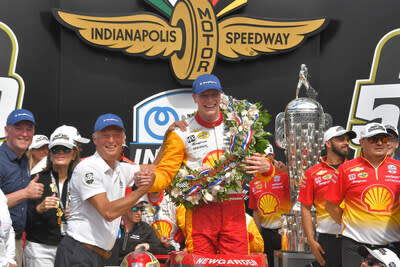 BorgWarner President and CEO Fr&#xe9;d&#xe9;ric Lissalde congratulates Josef Newgarden in Victory Circle with the Borg-Warner Trophy and Wreath after winning the 2023 Indianapolis 500