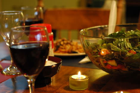 A glass of red wine is served with Moroccan salad.