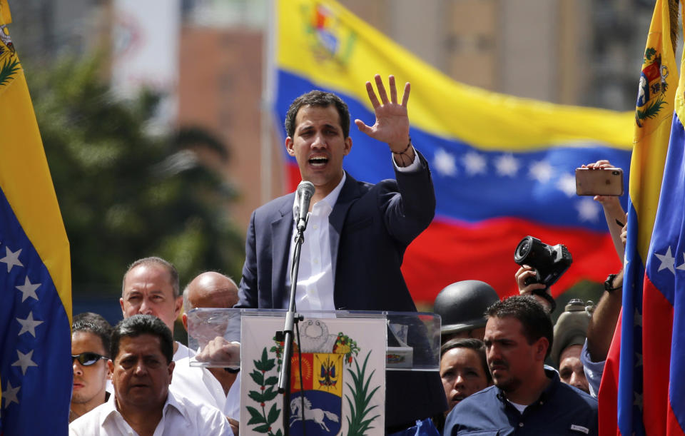 Juan Guaido, head of Venezuela's opposition-run congress, speaks to supporters at a rally where he declared himself interim president until new elections can be called in Caracas, Venezuela, Wednesday, Jan. 23, 2019. The opposition rally was called to demand President Nicolas Maduro's resignation. (AP Photo/Fernando Llano)