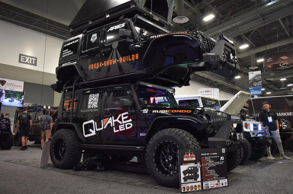 <p>Built from two Jeep Wrangler JKs, this wild combination was put together by Auto Definitions. The 2011 and 2013 Wranglers, a Rock Hard 4x4 roll cage, Aries Automotive bumpers and Quake LED lighting are topped off by a tent from <strong>Overland Vehicle Systems</strong>.</p>