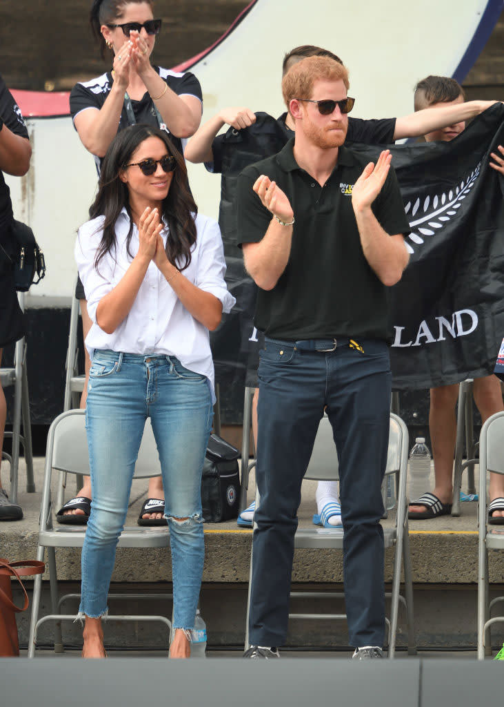 <p>Meghan chooses a light wash pair of denim jeans from Mother denim on her date with Prince Harry at the 2017 Invictus Games. (Photo: Karwai Tang/WireImage) </p>